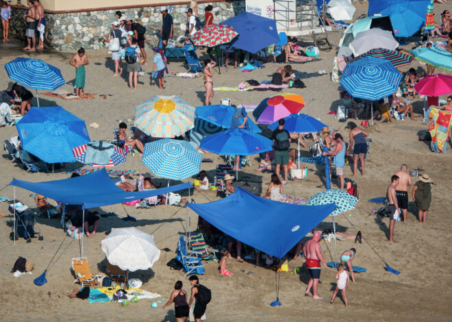 Wealthy Orange County city plans $500 fines for shade structures at beach