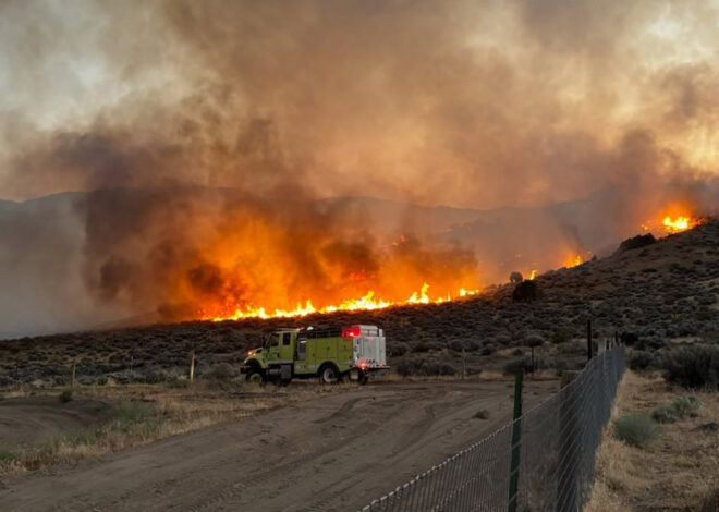 Massive wildfire erupts with fire tornado near Calif. border.