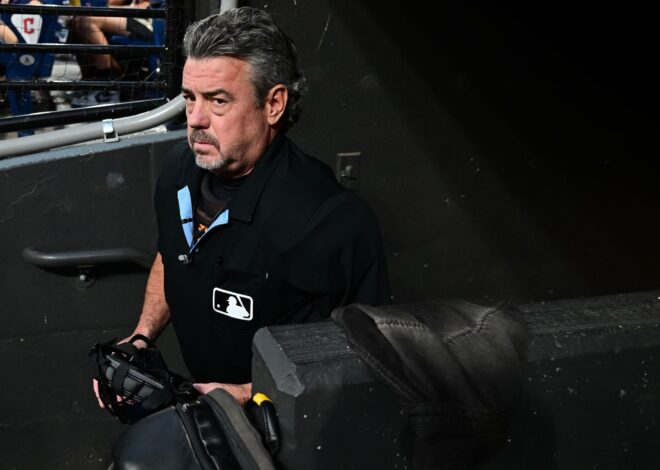 Umpire Jordan Baker out of Giants-Guards game due to concussion symptoms after foul ball hits mask