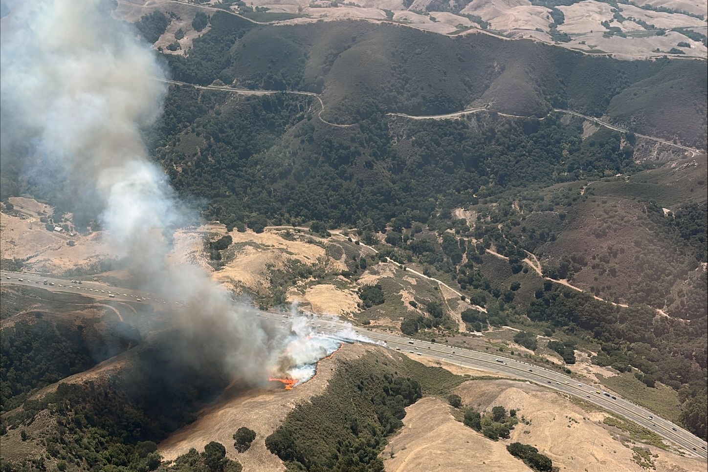 Progress stopped on wildfire near Cuesta Grade sparked by burning car