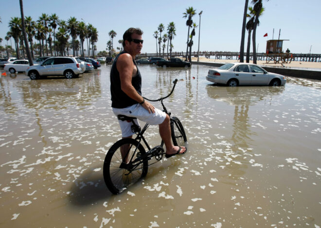 High tides overrun Newport Beach’s famous peninsula as city urges safety